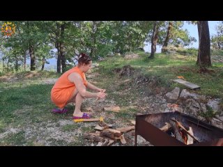 wood cutting mila. cooking on an open fire. milas naturist cooking. mila naturist. f248